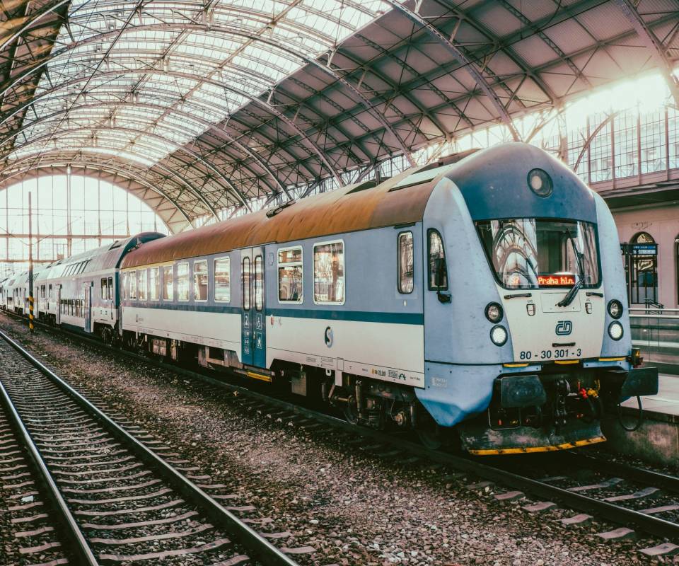 <a href="https://unsplash.com/@shaker_jpg?utm_source=unsplash&utm_medium=referral&utm_content=creditCopyText">Timur Shakerzianov</a> on <a href="https://unsplash.com/photos/a-passenger-train-pulling-into-a-train-station-YvehM1hi35k?utm_source=unsplash&utm_medium=referral&utm_content=creditCopyText">Unsplash</a>