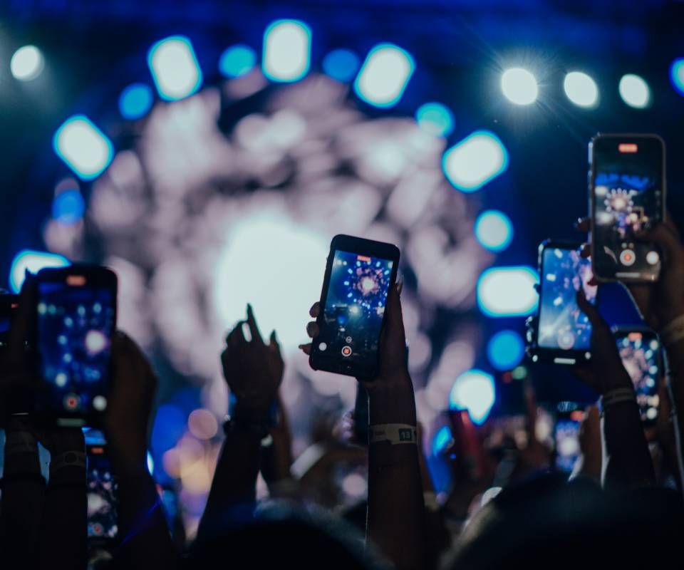 <a href="https://unsplash.com/@grish98?utm_source=unsplash&utm_medium=referral&utm_content=creditCopyText">Grisha Petrosyan</a> on <a href="https://unsplash.com/photos/a-group-of-people-holding-up-their-cell-phones-oiTIwUy5CNU?utm_source=unsplash&utm_medium=referral&utm_content=creditCopyText">Unsplash</a>