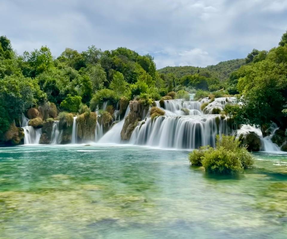 <a href="https://unsplash.com/@reesesiyu?utm_source=unsplash&utm_medium=referral&utm_content=creditCopyText">Reese Braam</a> on <a href="https://unsplash.com/photos/a-large-waterfall-in-the-middle-of-a-river-I81H9R74qok?utm_source=unsplash&utm_medium=referral&utm_content=creditCopyText">Unsplash</a>